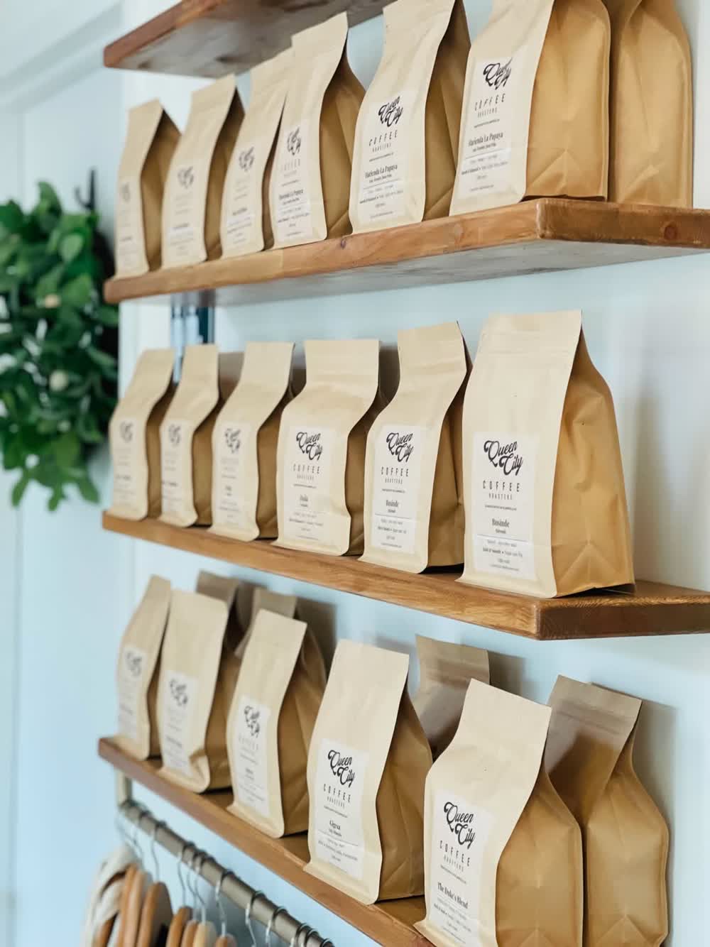 Queen City Coffee bags on shelf